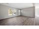 Living room with large windows and white door at 240 Carolina Dr, Saint Stephen, SC 29479