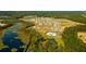 Aerial view of community featuring homes and a pond at 258 Wild Strawberry Ln, Moncks Corner, SC 29461