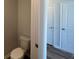 Small bathroom with toilet and access to other rooms at 291 Blue Haw Dr, Moncks Corner, SC 29461