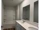 Bathroom with a bathtub, double vanity, and mirror at 291 Blue Haw Dr, Moncks Corner, SC 29461