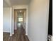 Bright entryway with wood-look flooring, leading to kitchen at 291 Blue Haw Dr, Moncks Corner, SC 29461