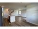 Modern kitchen flows into a spacious living room with hardwood floors at 291 Blue Haw Dr, Moncks Corner, SC 29461