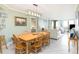 Light and airy dining room with wood table and chairs at 302 Summer House, Isle of Palms, SC 29451