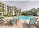 Relaxing pool area with patio furniture at 302 Summer House, Isle of Palms, SC 29451