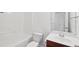 White bathroom with single vanity and tub shower at 3026 Gulfstream Ln, Ridgeville, SC 29472