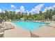 Community swimming pool with lounge chairs at 3026 Gulfstream Ln, Ridgeville, SC 29472