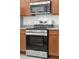 Stainless steel Frigidaire appliances and wood cabinets in this kitchen at 3026 Gulfstream Ln, Ridgeville, SC 29472