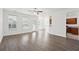 Spacious living room with hardwood floors and access to the kitchen at 3026 Gulfstream Ln, Ridgeville, SC 29472