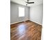 Bright bedroom with hardwood floors and ceiling fan at 348 Cleveland St, Walterboro, SC 29488