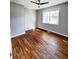 Bright bedroom featuring hardwood floors and ceiling fan at 348 Cleveland St, Walterboro, SC 29488