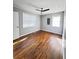 Spacious bedroom with hardwood floors and two windows at 348 Cleveland St, Walterboro, SC 29488