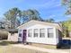 Charming one-story home with white siding and purple door at 348 Cleveland St, Walterboro, SC 29488