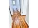 Hardwood floors in a bright hallway with access to bedrooms at 348 Cleveland St, Walterboro, SC 29488