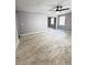 Open living room with gray walls and wood-look floors at 348 Cleveland St, Walterboro, SC 29488