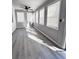Sunroom with gray walls, white trim, and wood-look floors at 348 Cleveland St, Walterboro, SC 29488