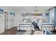 Twin bedroom with metal framed beds, blue and white bedding, and surf wall art at 358 Trailmore Ln, Summerville, SC 29486