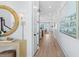 Bright and airy hallway with light wood floors, leading to kitchen at 358 Trailmore Ln, Summerville, SC 29486