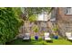 Relaxing backyard with lounge chairs and ivy covered wall at 38 Hasell St, Charleston, SC 29401