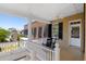 Relaxing balcony with rocking chair, white railings, and view of the city at 38 Hasell St, Charleston, SC 29401