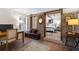 Charming basement office features exposed brick, a built-in bench, and a workspace with natural light at 38 Hasell St, Charleston, SC 29401