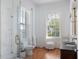 Spa-like bathroom with marble finishes and a large glass shower at 38 Hasell St, Charleston, SC 29401