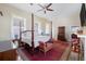 Spacious main bedroom with a four-poster bed and rich decor at 38 Hasell St, Charleston, SC 29401