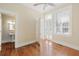 Spacious bedroom with hardwood floors and access to a private balcony at 38 Hasell St, Charleston, SC 29401
