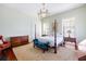 Elegant Primary bedroom with a four-poster bed and antique furniture at 38 Hasell St, Charleston, SC 29401