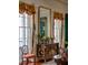 Elegant dining room with ornate furniture and large windows at 38 Hasell St, Charleston, SC 29401