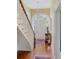 Grand entryway with a curved staircase and hardwood floors at 38 Hasell St, Charleston, SC 29401