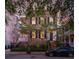 Brick home with black shutters and a landscaped front yard at 38 Hasell St, Charleston, SC 29401