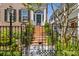 Ornate iron gate and stairway leading to front entrance at 38 Hasell St, Charleston, SC 29401