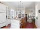 Spacious kitchen with white cabinets, granite counters, and island at 38 Hasell St, Charleston, SC 29401