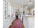 White kitchen with granite island and stainless steel appliances at 38 Hasell St, Charleston, SC 29401