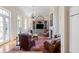 Bright living room features a fireplace, built-in shelving, and hardwood floors at 38 Hasell St, Charleston, SC 29401