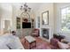Elegant living room with built-in shelving, fireplace, and hardwood floors at 38 Hasell St, Charleston, SC 29401