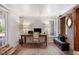 Home office with brick walls, wooden desk, and access to backyard at 38 Hasell St, Charleston, SC 29401