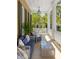 Relaxing porch with wicker furniture and lush landscaping at 38 Hasell St, Charleston, SC 29401