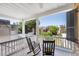 Relaxing porch with rocking chairs, offering stunning city views at 38 Hasell St, Charleston, SC 29401