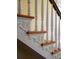 Close-up of the intricate staircase's carved details at 38 Hasell St, Charleston, SC 29401
