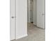 Bright hallway with white doors and gray carpet at 382 Willows Crescent Dr, Moncks Corner, SC 29461