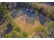 Drone view of a horse farm with house and riding arena at 3980 River Rd, Johns Island, SC 29455