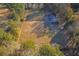Aerial view of equestrian property with home, arena, and pastures at 3980 River Rd, Johns Island, SC 29455