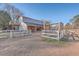Barn with adjacent paddock and fencing at 3980 River Rd, Johns Island, SC 29455