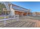 Exterior view of barn with stalls and a gate at 3980 River Rd, Johns Island, SC 29455
