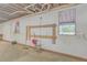 Unfinished basement area with windows and tools at 3980 River Rd, Johns Island, SC 29455
