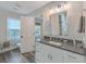 Modern bathroom with white vanity and dark countertop at 3980 River Rd, Johns Island, SC 29455