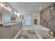 Modern bathroom with double vanity, soaking tub, and walk-in shower at 3980 River Rd, Johns Island, SC 29455