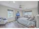 Bright bedroom featuring a comfortable bed and large windows at 3980 River Rd, Johns Island, SC 29455