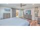 Spacious bedroom with built-in shelving and en-suite bathroom access at 3980 River Rd, Johns Island, SC 29455